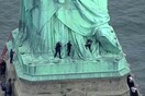 Διαδηλώτρια ανέβηκε στο Άγαλμα της Ελευθερίας για να διαμαρτυρηθεί εναντίον του Τραμπ
