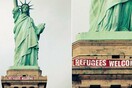 Το Άγαλμα της Ελευθερίας καλωσορίζει τους πρόσφυγες με πανό που τοποθέτησαν ακτιβιστές