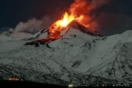 Italy’s Mount Etna spews lava down snow-covered slopes