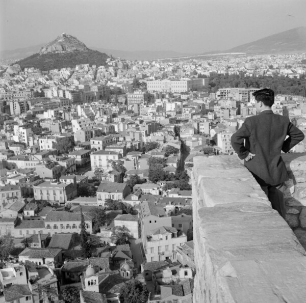 Greece, man looking over Athens from Acropolis